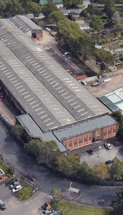 Aerial view of Tansun building with a large British flag in the foreground, Tansun factory west midlands made sunbeds, British made sunbeds Tansun factory
